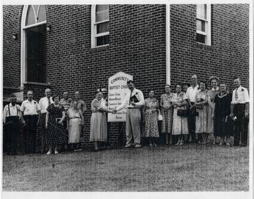 Pastor Gordon Taylor and members of the church standing outside in the early 1950's.