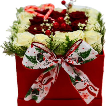 Festive flower arrangement in a red box with a Christmas-themed bow and candy canes.