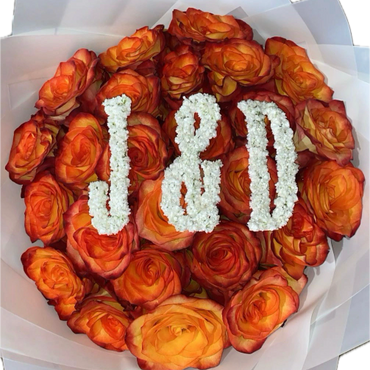 Bouquet of orange roses with white flowers forming J & D initials.
