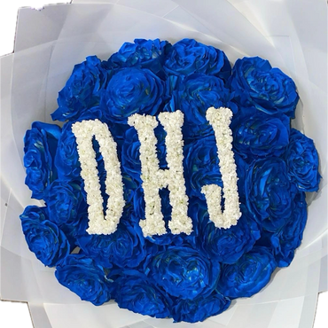Bouquet of vibrant blue roses with white flowers forming the initials DHJ.