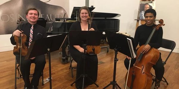 String Trio performing live music for a wedding cocktail hour reception.