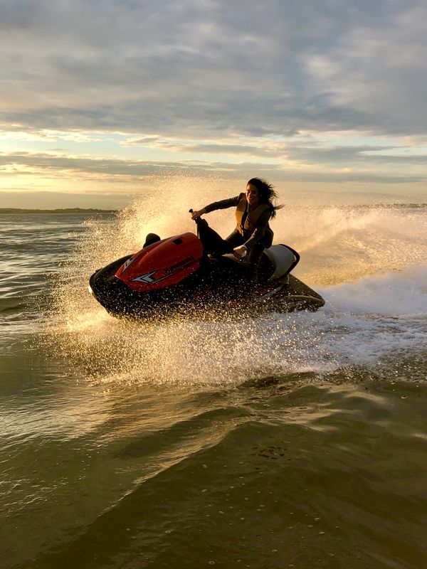 Jetski in a suit sunset keyport jersey city NJ new york city Kawasaki Yamaha Seadoo woman jet skiier
