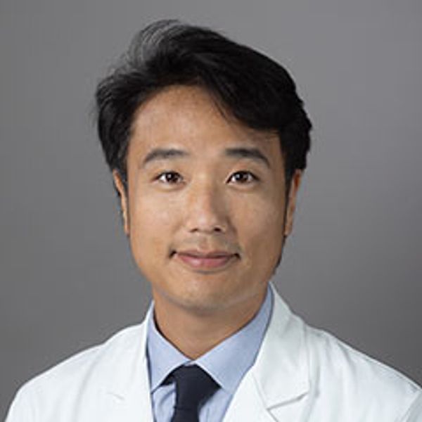 Professional man in a white medical coat and tie.