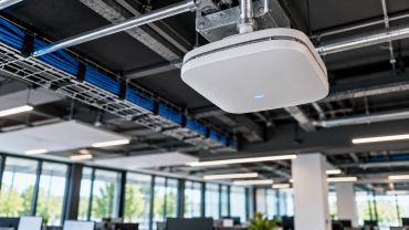 Commercial wireless access point installed for reliable enterprise Wi-Fi network coverage.