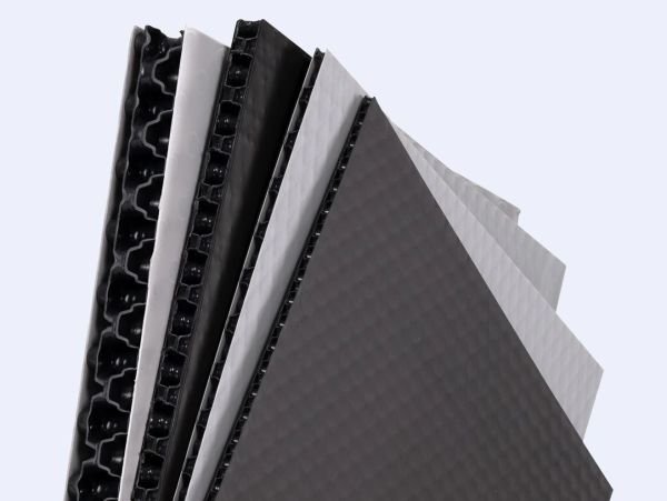 Stack of black and white honeycomb panels.