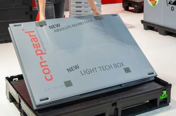 A large gray con-pearl box with technical labels on it.