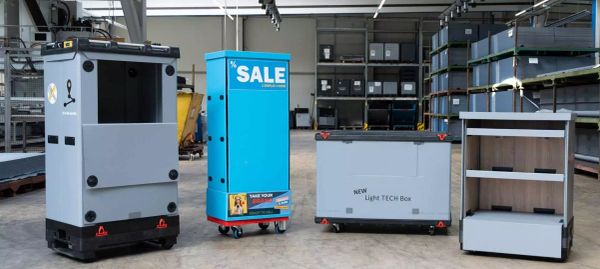 Four different types of smart delivery boxes in a warehouse.