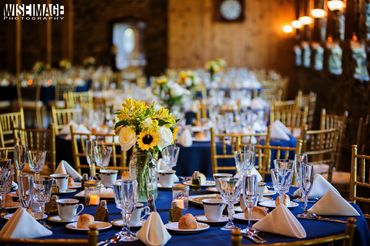 Elegant banquet tables with floral centerpieces and sparkling glassware.