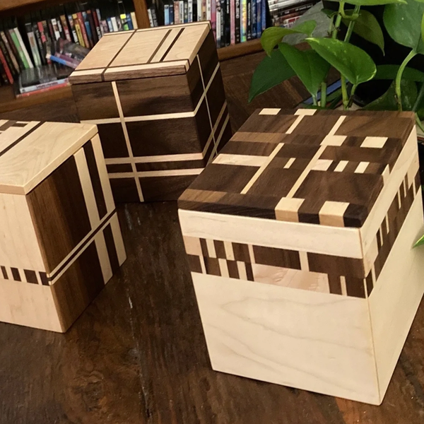 Walnut and maple handcrafted wood boxes by Sandra Hoover.