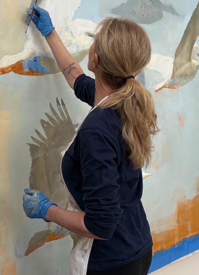 Women apply the painting on wall