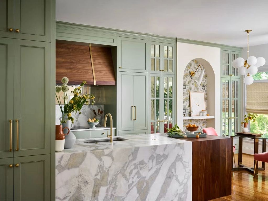 Traditional sage green shaker kitchen with white marble island