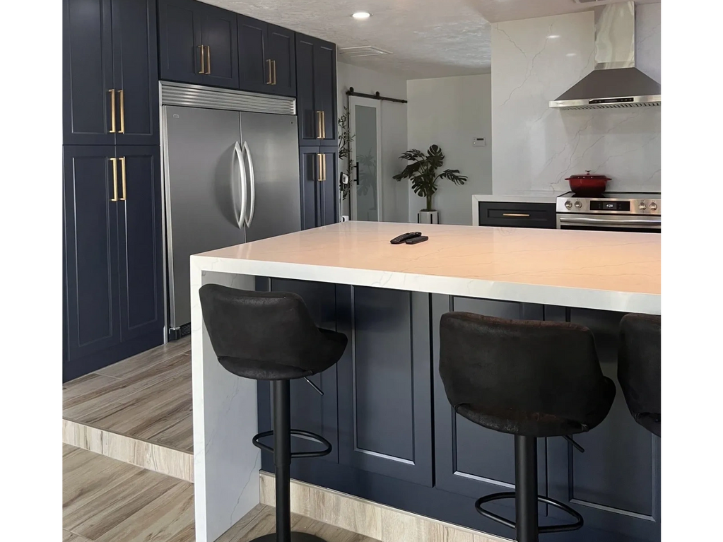 Matte black shaker kitchen with white quartz countertop