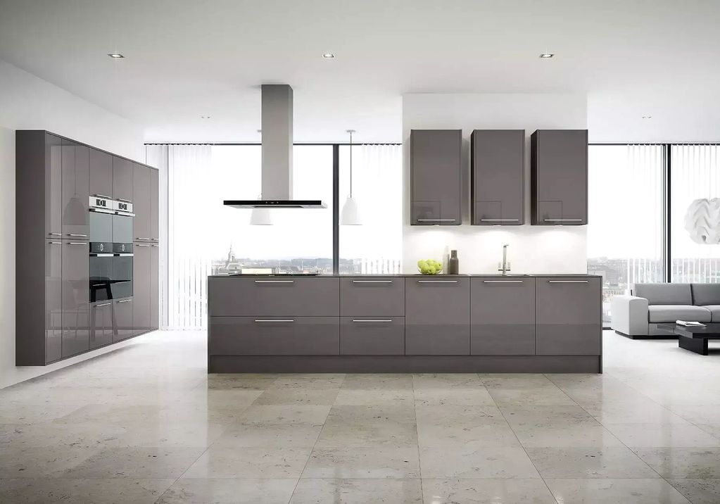 A modern Daimler collection kitchen with chestnut glossy doors and a suspended kitchen extractor