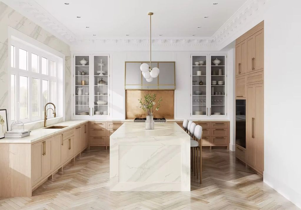 Light oak inset shaker kitchen with a bold central marble island