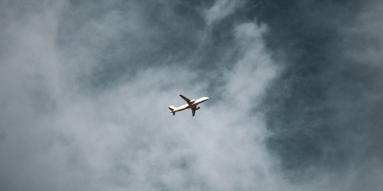 An aircraft flying among the clouds