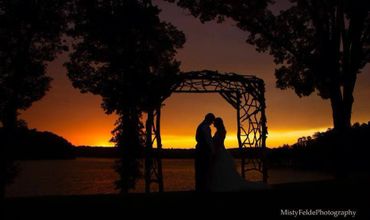 A silhouette under the wooden arch with a beautiful sunset in the backdrop!