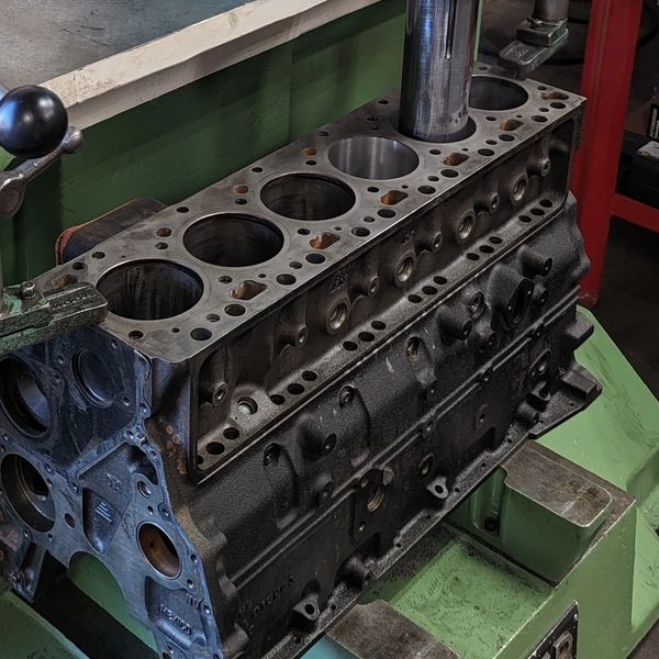 Disassembled engine block on a Rottler boring bar.