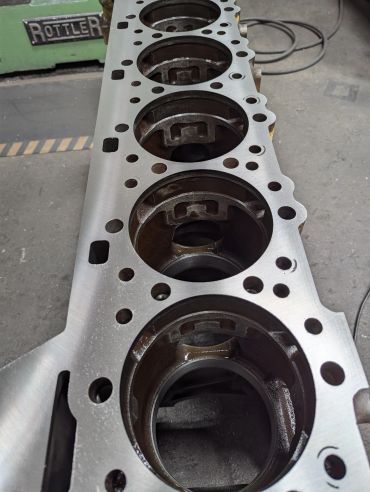 Close-up of an engine block's cylinder head surface.