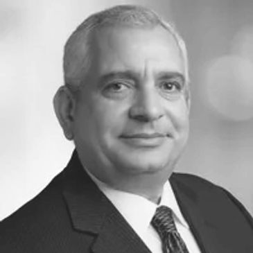 Black and white portrait of a middle-aged man in a suit.