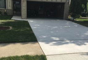 Removed  garage and driveway cement and replaced  by Portofino Construction