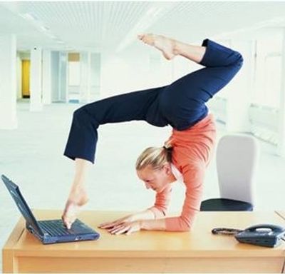 Flexible woman toes on keyboard