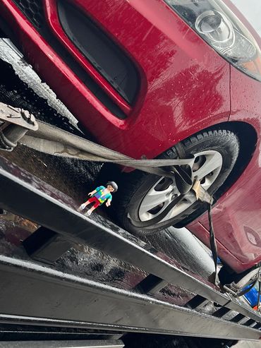Wrecker towing a non-operational car in Burnaby for recycling