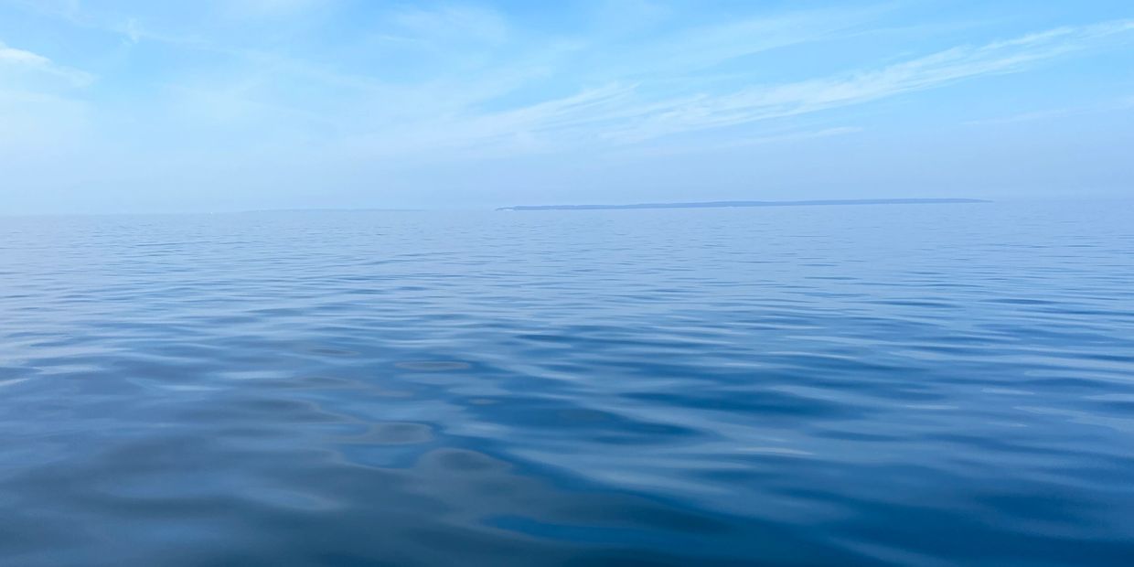 Calm blue Great Lakes water on a clear summer day