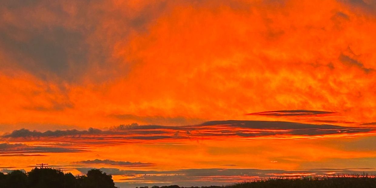 Orange sunset sky over the Great Lakes region