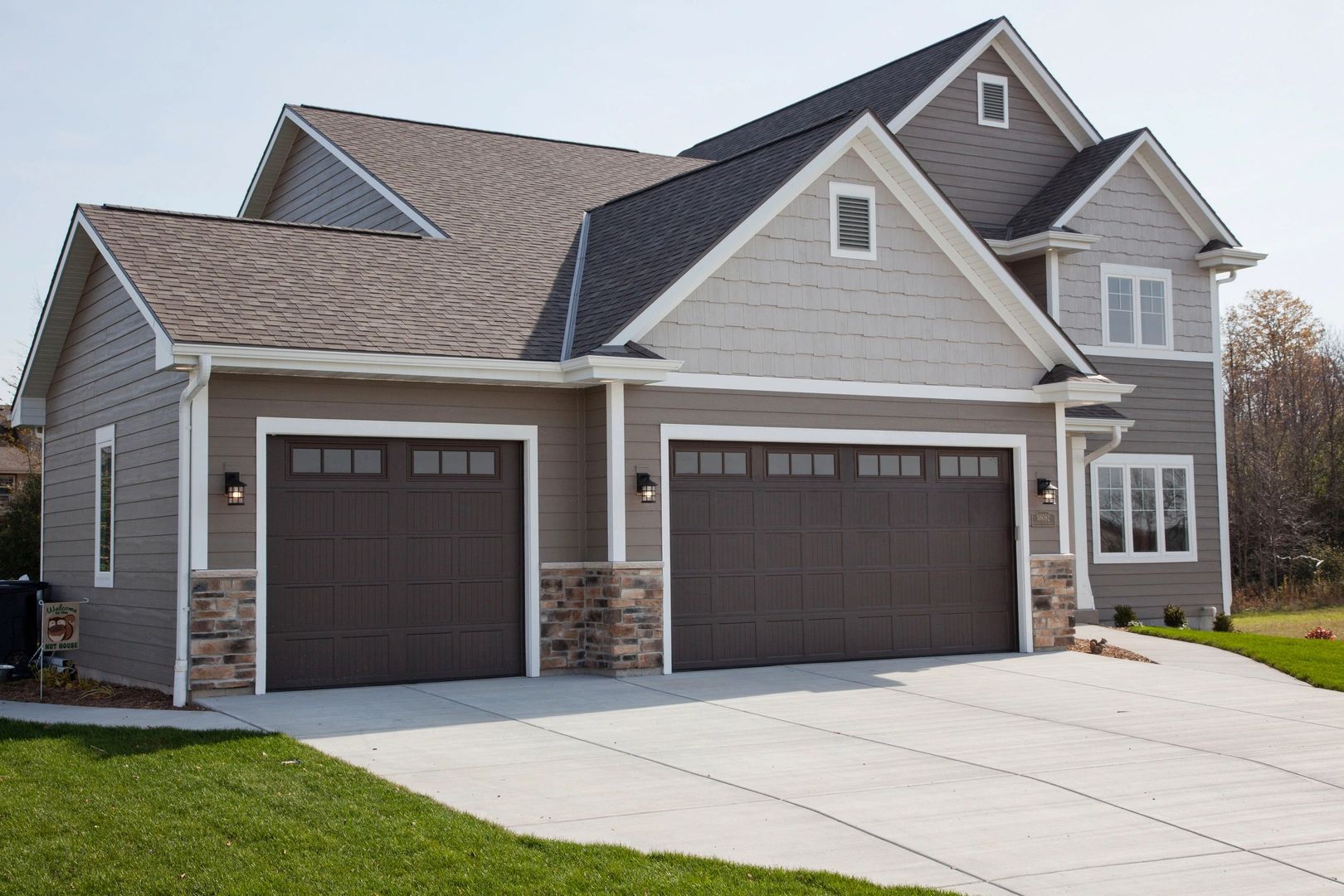 gray house brown garage door