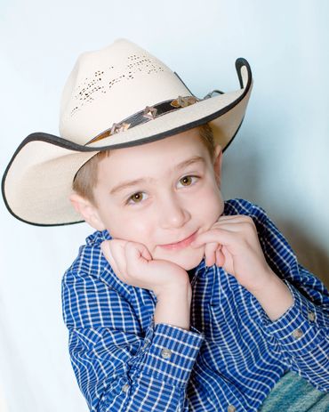 Child photography of boy in cowboy hat