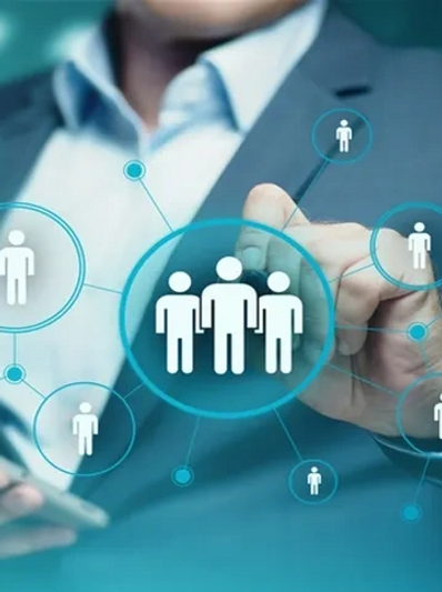 Businessman interacting with digital network icons representing social or professional connections.