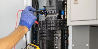 Electrician diagnosing electrical panel and breaker issues in Bergen County home