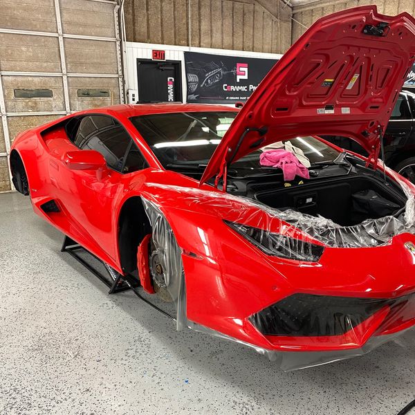 Red sedan Lamborghini with paint protection installation in Mckinney
