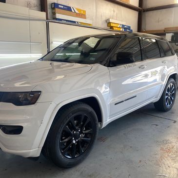 Custom black out package on white suv including roof and pillars by Prestige Tint in Mckinney Tx