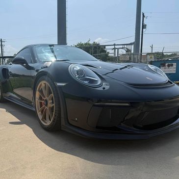 Gloss Paint protection film on black Porsche full car in McKinney protection against road grime