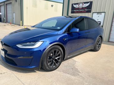 Tesla Model Y with nano-ceramic window tinting, showing maximum heat rejection and UV protection