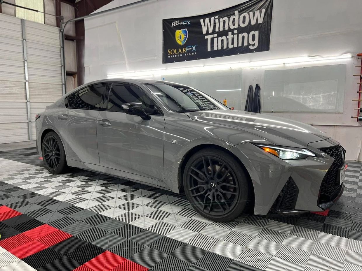 Ceramic window tint on gray luxury sedan for heat rejection in McKinney
