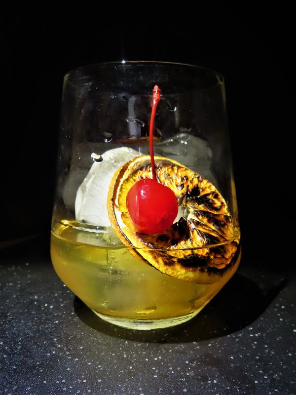 Smokey, citrus, bitter, a smooth taste....It's the classic combination...It's the Old Fashion