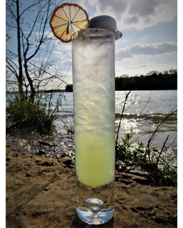 A Tom Collins... He is a gentleman, who loves his gin and lemon.