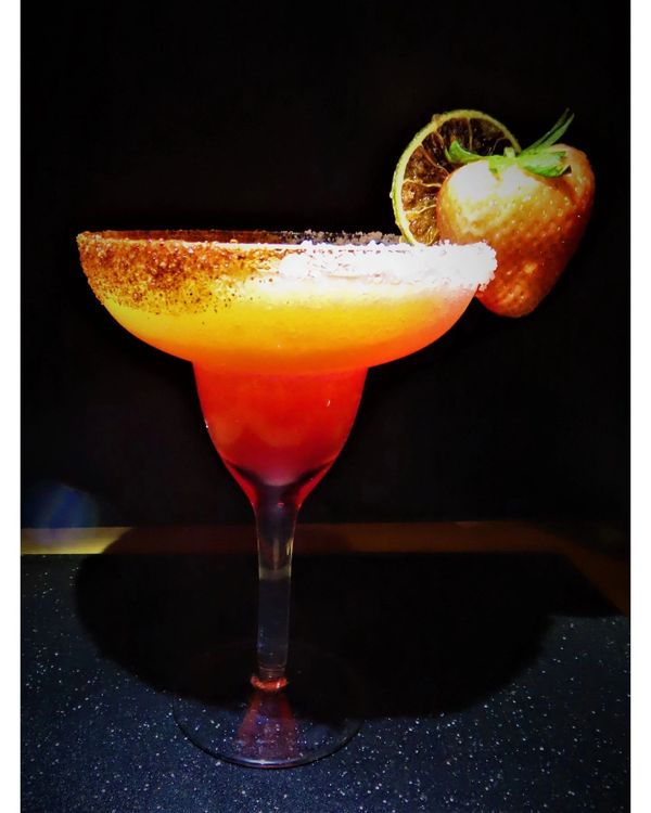 This Mango Strawberry Margarita is so good... one sip and you're on a flight straight to a beautiful