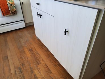 tall trash cabinet next to Pots ad pans rollout.