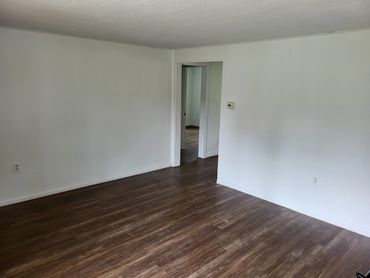 The living room opens up to a eat in Kitchen