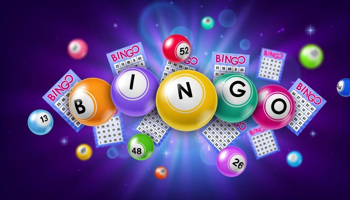 Colorful bingo balls and cards in space.