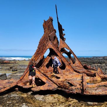 A picture of the old ship on the sea shore