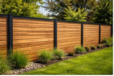 Modern wooden fence with black metal frames and garden plants.