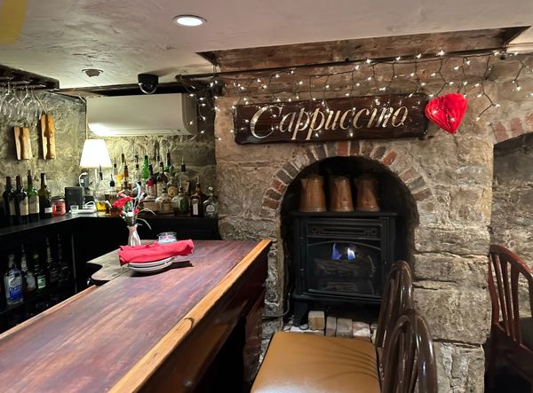 end of bar and fireplace