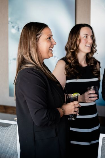 Team members dressed in black at an event.