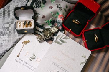 Cartier wedding bands, cufflinks, watch and invitations.