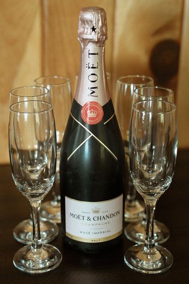 Moet Chandon and four champagne glasses.