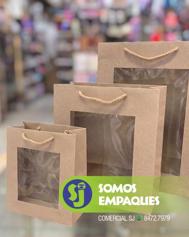 Eco-friendly kraft paper gift bags with elegant striped and polka dot patterns, featuring durable tw